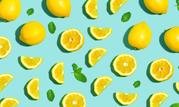 Fresh lemon pattern on a bright color background flat lay