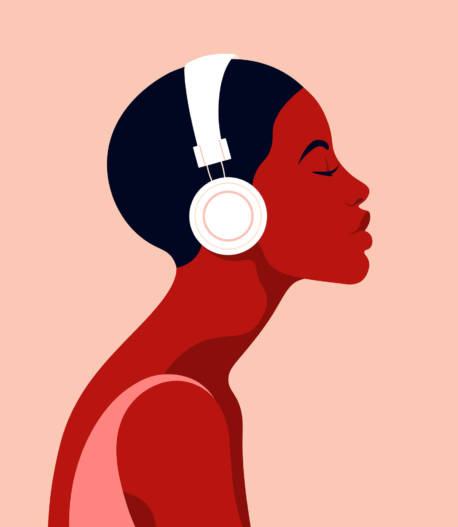 The girl listens to music on headphones. Music therapy. Profile